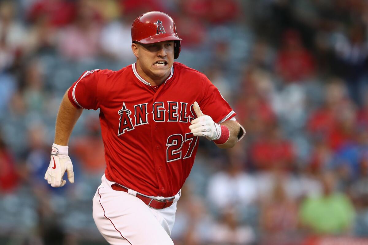 Angels outfielder Mike Trout (27) runs to first during the first inning of a game against the Toronto Blue Jays on Sept. 17.