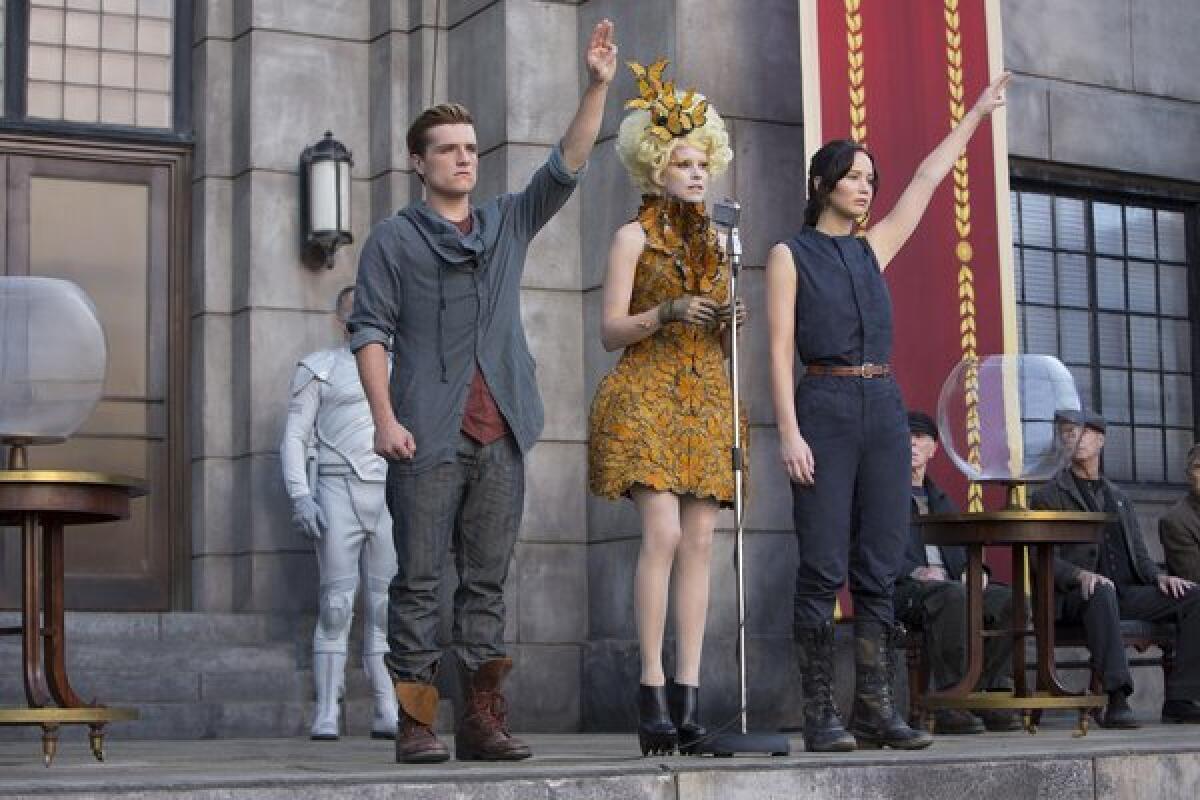 Josh Hutcherson, Elizabeth Banks and Jennifer Lawrence appear in a scene from "The Hunger Games: Catching Fire."