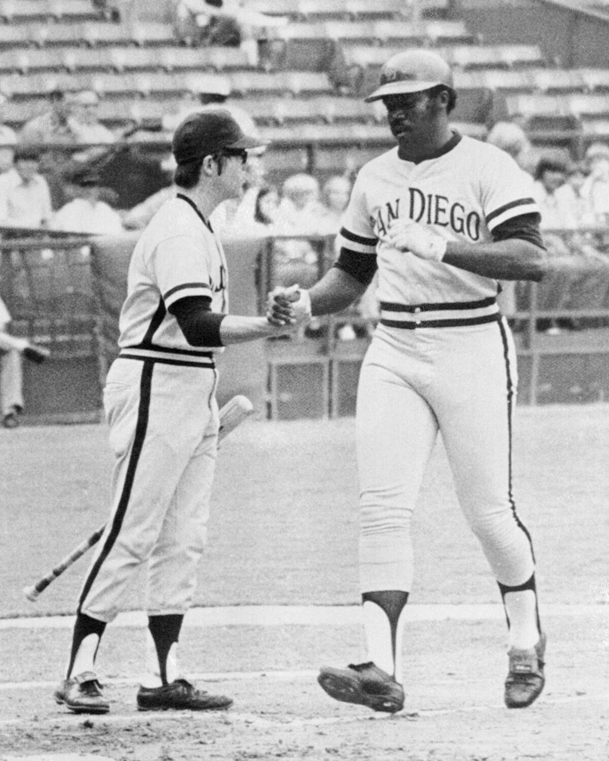 Nate Colbert, right, of the San Diego Padres,