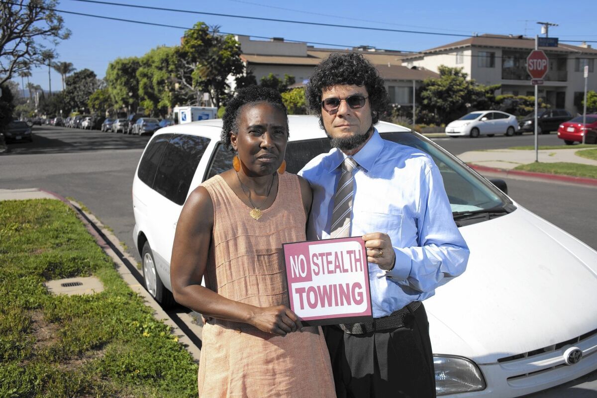 Jerolyn Sackman, with husband, J. David Sackman, who says: “Even if you try to follow the law and the signs scrupulously, you can still get towed.”
