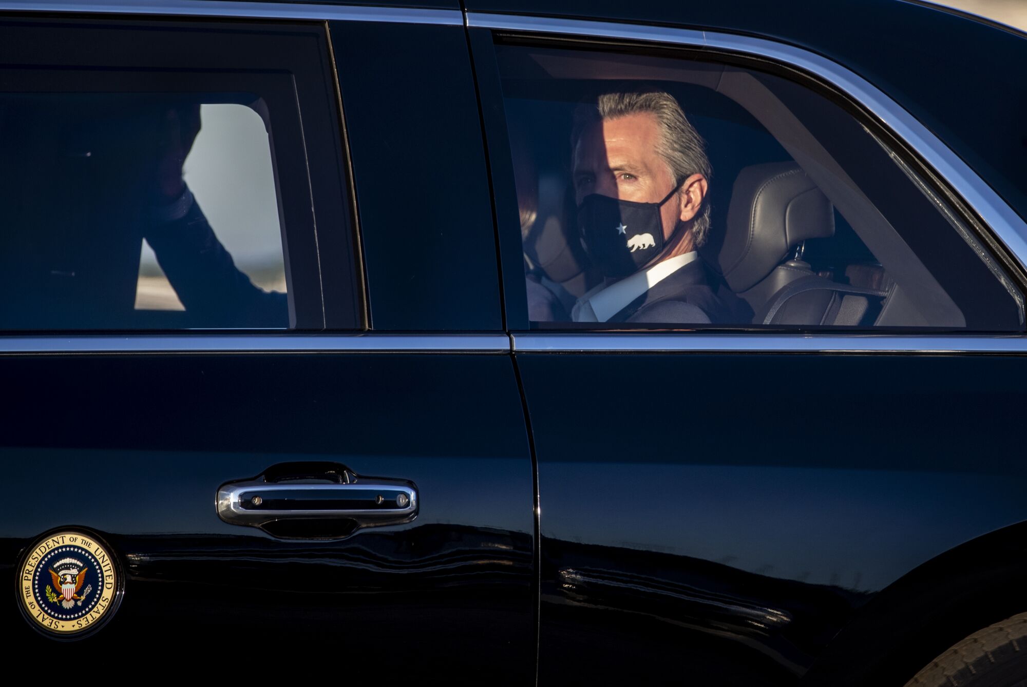 California Gov. Gavin Newsom joins President Biden in his motorcade.
