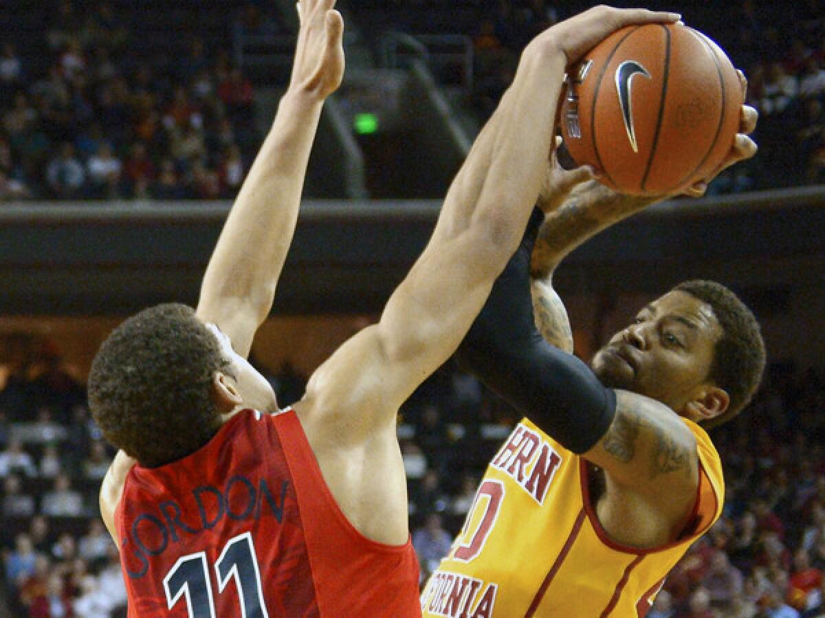 Arizona forward Aaron Gordon, left, blocks a shot by USC guard J.T. Terrell during the Trojans' 73-53 loss Sunday at the Galen Center.