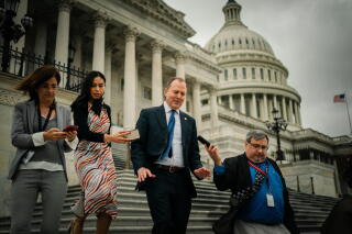 Rep. Adam Schiff talks with reporters as he walks down the steps of the House of Representatives