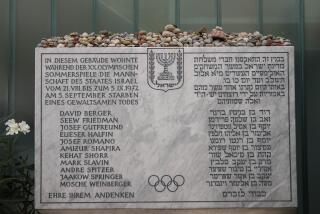 A memorial plaque for the eleven athletes from Israel and one German police officer were killed in a terrorist attack during the Olympic Games 1972, stands at the former accommodation of the Israeli team in the Olympic village in Munich, Germany, Saturday, Aug. 27, 2022. The families of 11 Israeli athletes killed by Palestinian attackers at the 1972 Summer Olympics and the German government are close to reaching a deal over the long-disputed amount of the compensation. (AP Photo/Matthias Schrader)