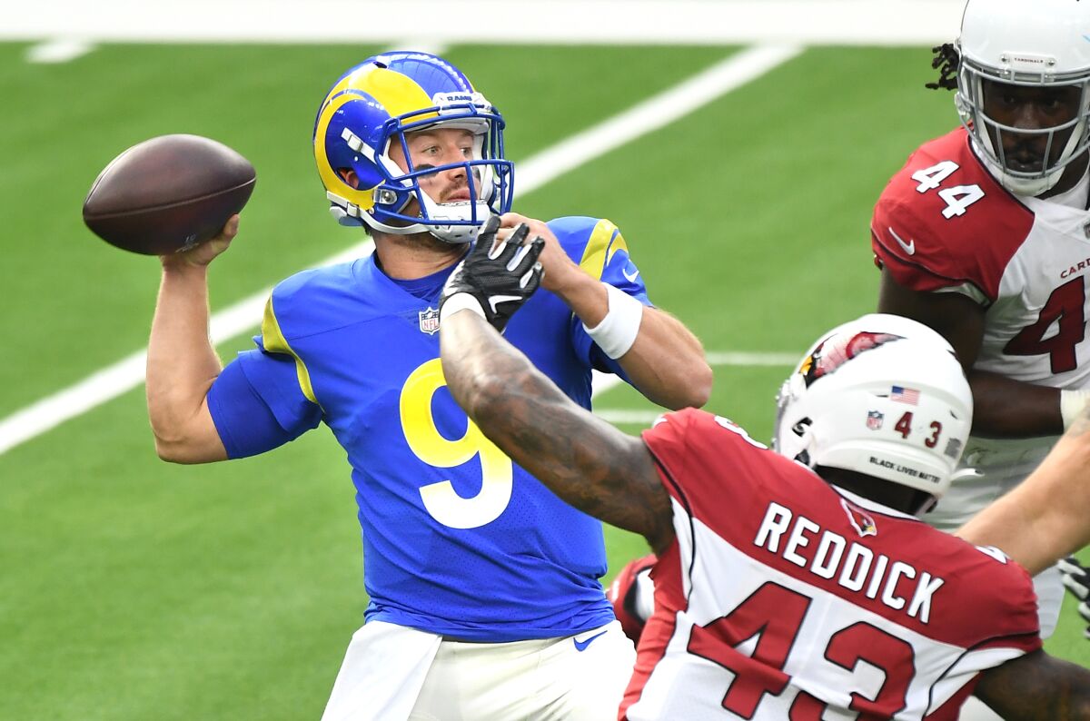 Rams quarterback John Wolford throws a pass against the Arizona Cardinals.