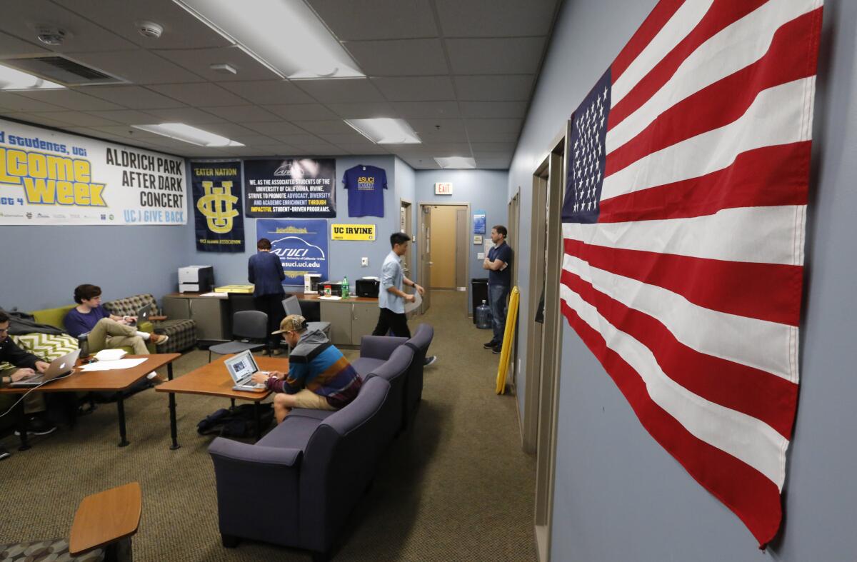 The American flag has been rehung on the wall of the UC Irvine student government center days after a student government decision to ban all flags from this office set off a firestorm of protests from students and the public. The ban was later vetoed.