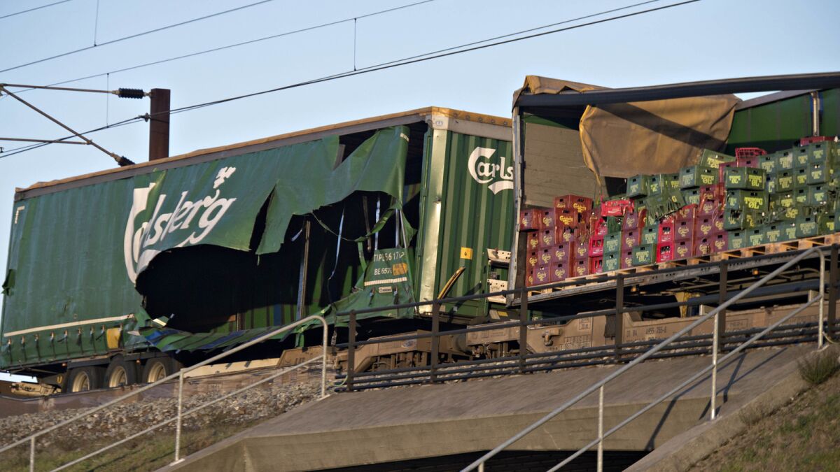 Damaged cars of a freight train near the Storebaelt bridge in Denmark