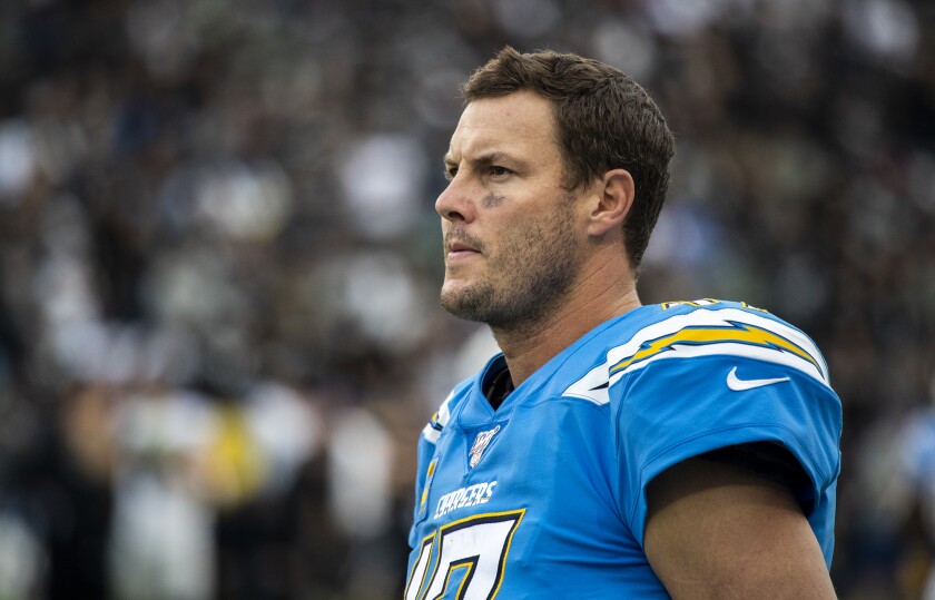 Chargers quarterback Philip Rivers watches from the sideline during Sunday's loss to the Oakland Raiders.