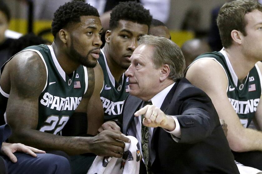 Michigan State Coach Tom Izzo speaks with Branden Dawson (22) during a game against Maryland on Jan. 17, 2015.