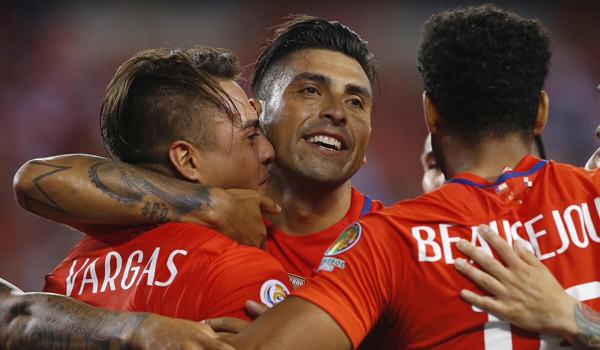 Chile's Eduardo Vargas, left, is congratulated by teammates Gonzalo Jara, center, and Jean Beausejour after scoring against Panama during the 2016 Copa America Centenario Group D match on Tuesday.