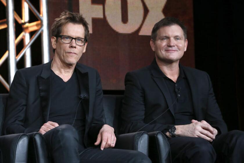 Kevin Bacon, left, and Executive Producer/Creator Kevin Williamson from "The Following" attend the Fox Winter TCA Tour