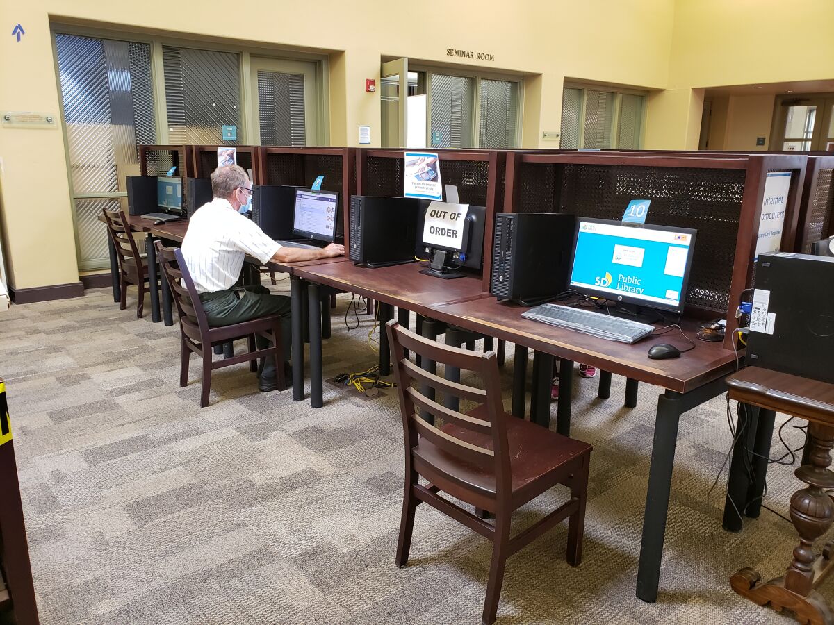 A visitor uses a computer at the La Jolla/Riford Library in October.