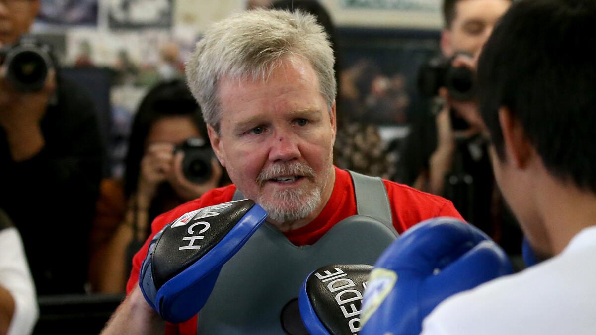 Boxing trainer Freddie Roach takes part in a sparring session with Manny Pacquiao at Wild Card Boxing Gym in Hollywood in April.