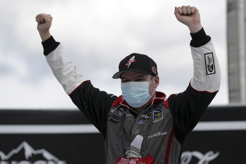 Cole Custer celebrates after winning a NASCAR Cup Series auto race.