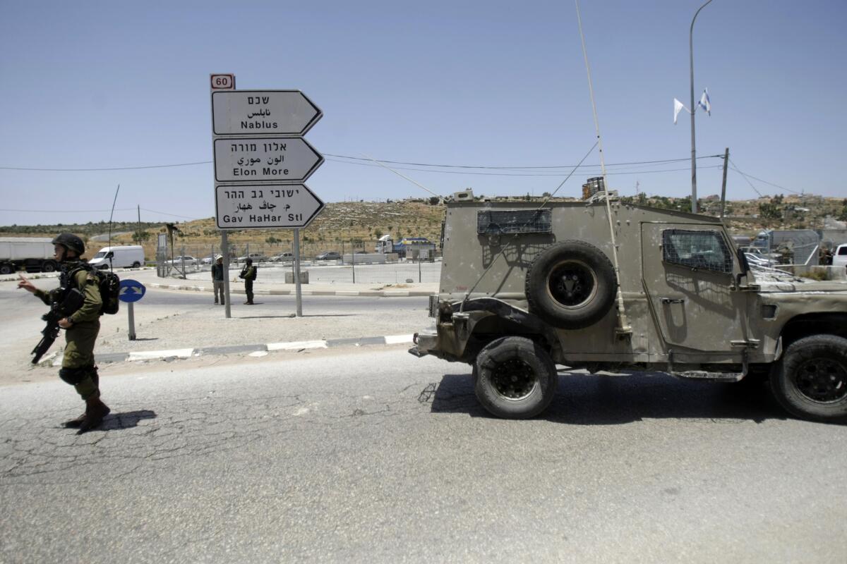 Israeli soldiers at a West Bank checkpoint south of Nablus.