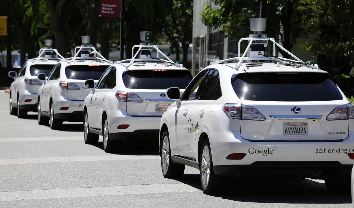 Google self-driving cars line up in Mountain View, Calif., in 2014.