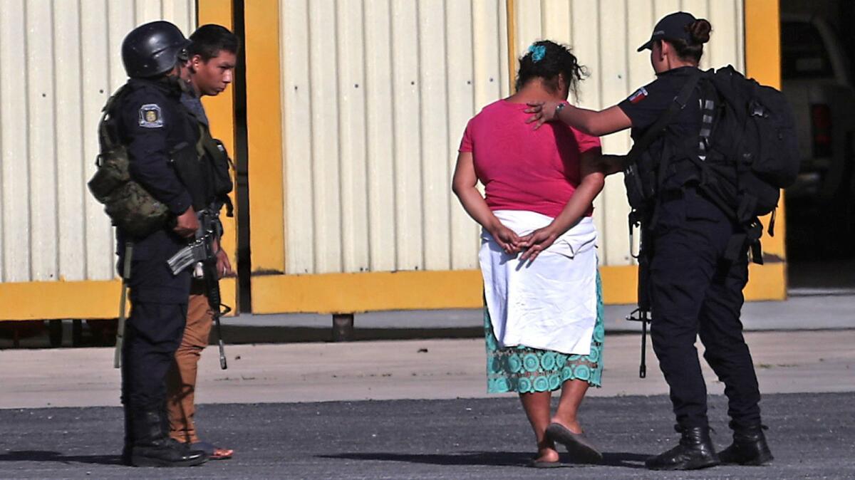 Police officers guard hostages during their release in the southern Mexican state of Guerrero.