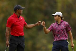 ORLANDO, FLORIDA - DECEMBER 17: Tiger Woods of the United States and son, Charlie Woods, react on the 15th green during the final round of the PNC Championship at The Ritz-Carlton Golf Club on December 17, 2023 in Orlando, Florida. (Photo by Mike Ehrmann/Getty Images)