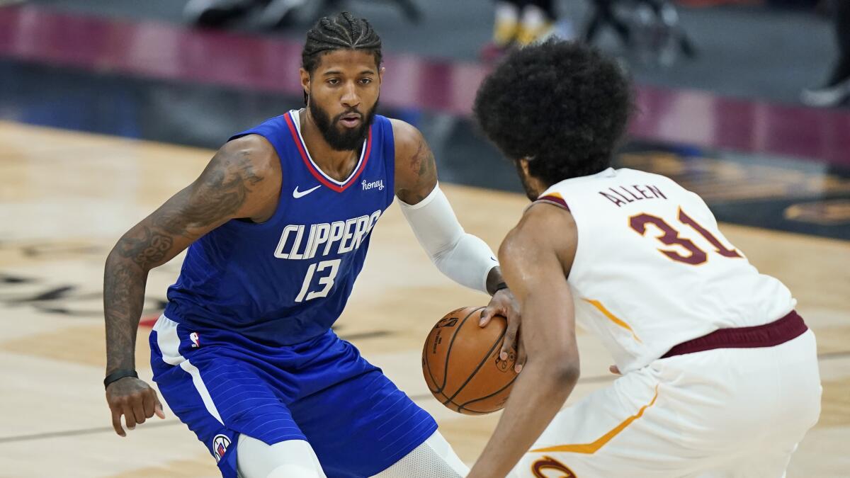 Clippers guard Paul George controls the ball during a win over the Cavaliers on Wednesday.