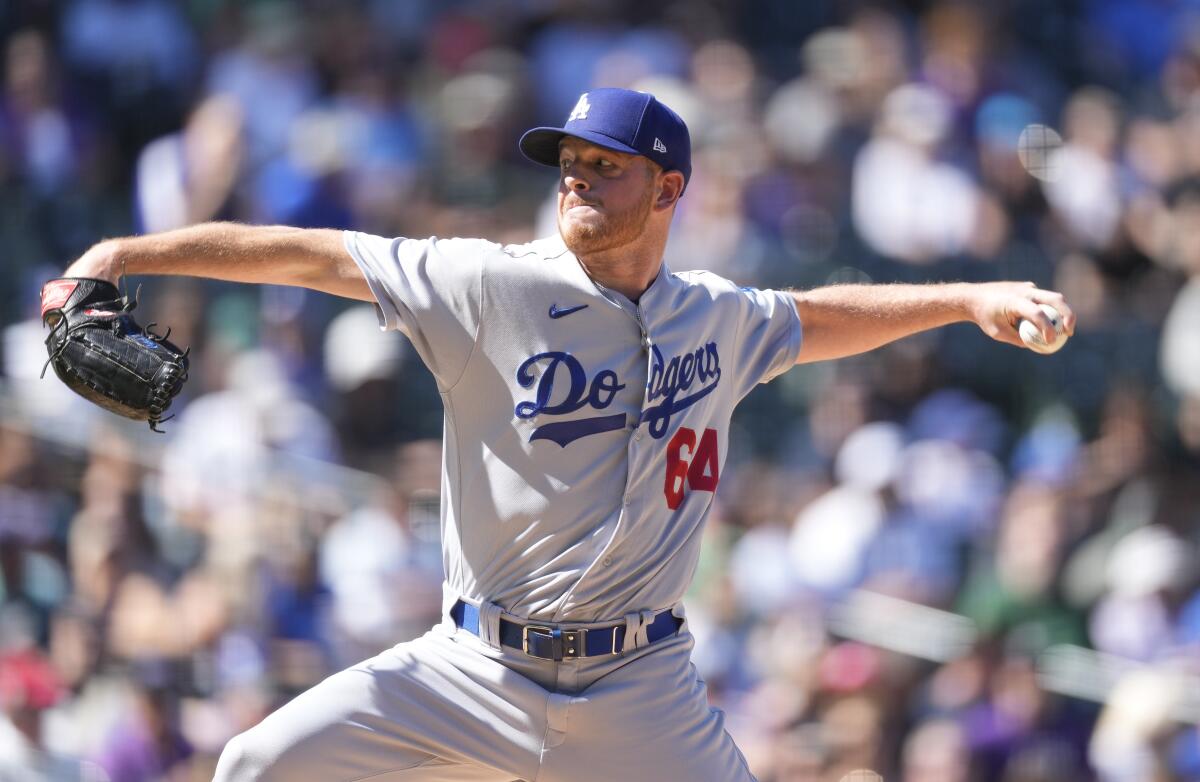 FILE - Los Angeles Dodgers starting pitcher Caleb Ferguson works against the Colorado Rockies in the first inning of the first game of a baseball doubleheader, Sept. 26, 2023, in Denver. The Yankees acquired left-handed reliever Ferguson from the Dodgers in exchange for minor league pitchers Matt Gage and Christian Zazueta. (AP Photo/David Zalubowski, File)