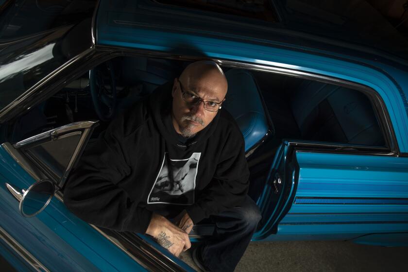 WINNETKA, CA - APRIL 07: Director Estevan Oriol sits for a portrait in his 1964 Chevrolet Impala at his home on Tuesday, April 7, 2020 in Winnetka, CA. (Brian van der Brug / Los Angeles Times)