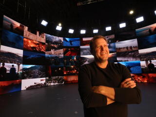 Jon Erwin stands in front of a screen of LED panels he used to film "The Old Stories: Moses"