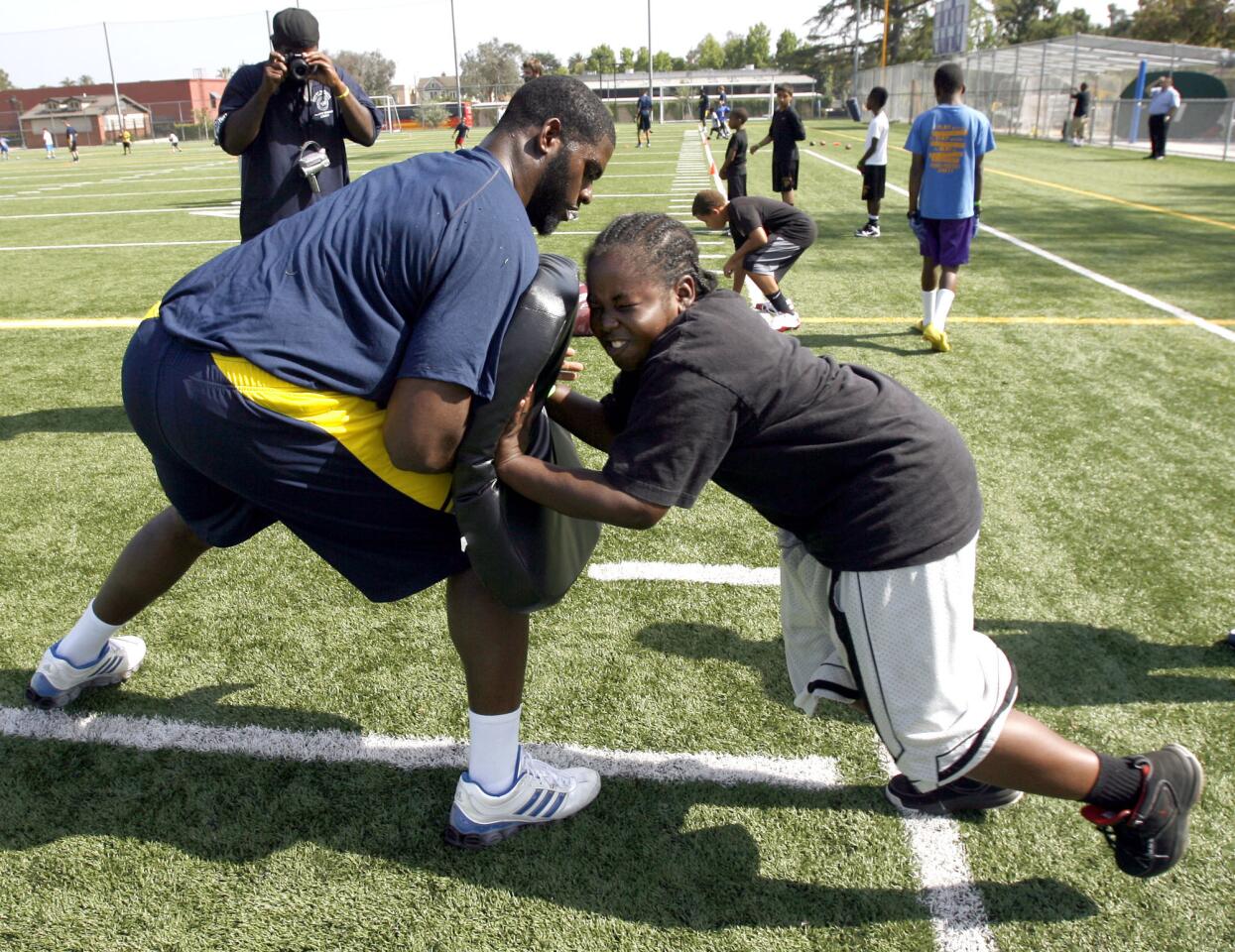 Photo Gallery: University of Michigan football players help local kids