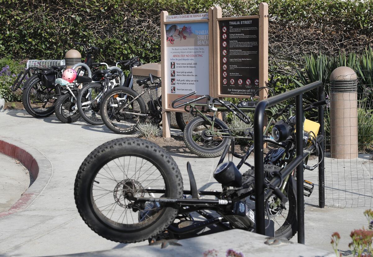 E-bikes parked at Thalia Street beach on Friday.