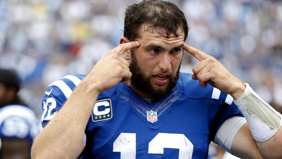 Colts quarterback Andrew Luck, talking to teammates on the sideline during Sunday's win against the Titans, has been limited in practice this week because of a shoulder injury.
