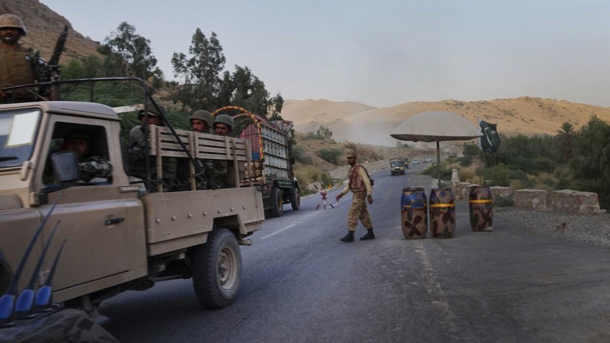 Soldiers at a checkpoint on the road east of Miramshah.