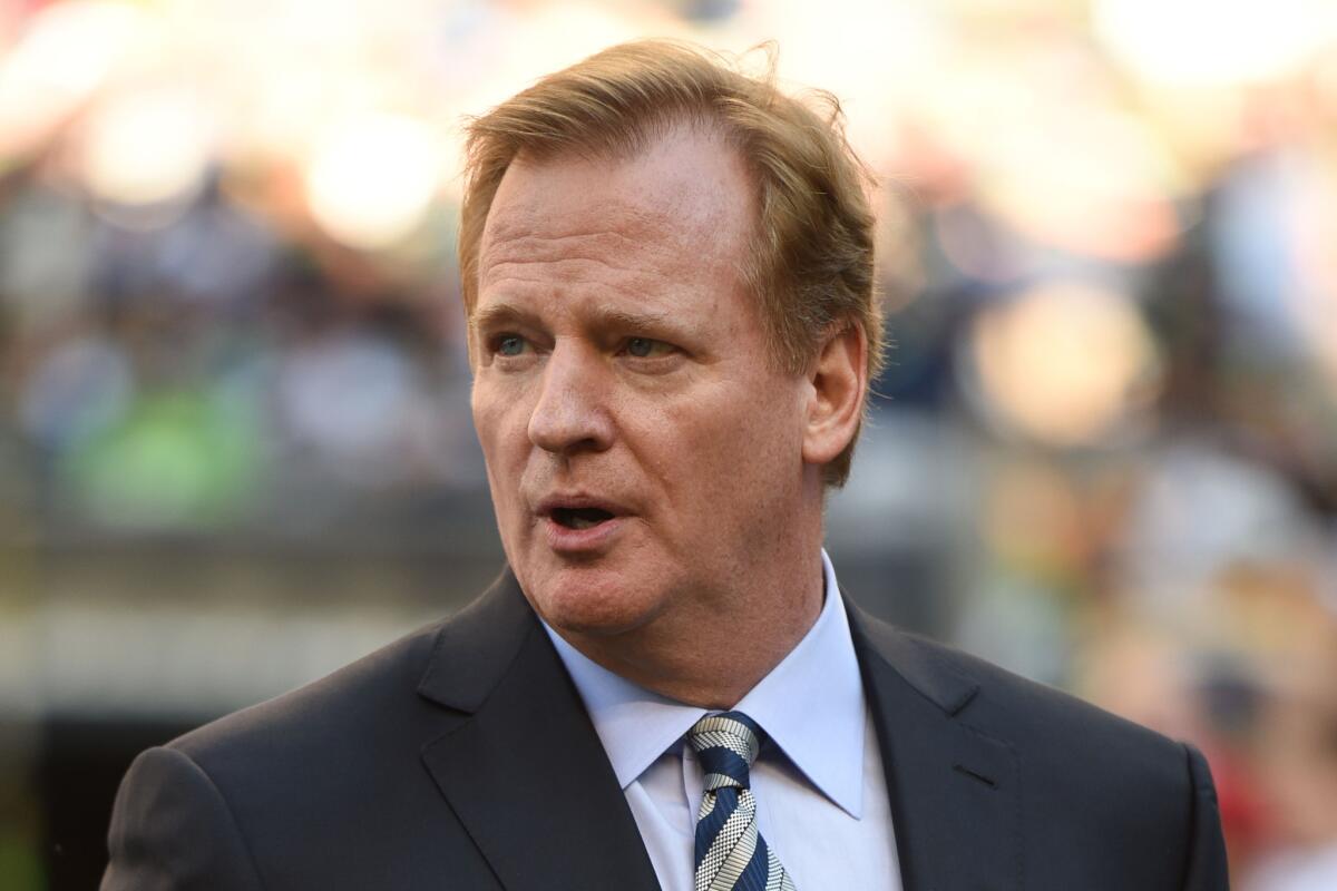 NFL Commissioner Roger Goodell walks the sidelines before the game between the Seattle Seahawks and the Green Bay Packers at CenturyLink Field.