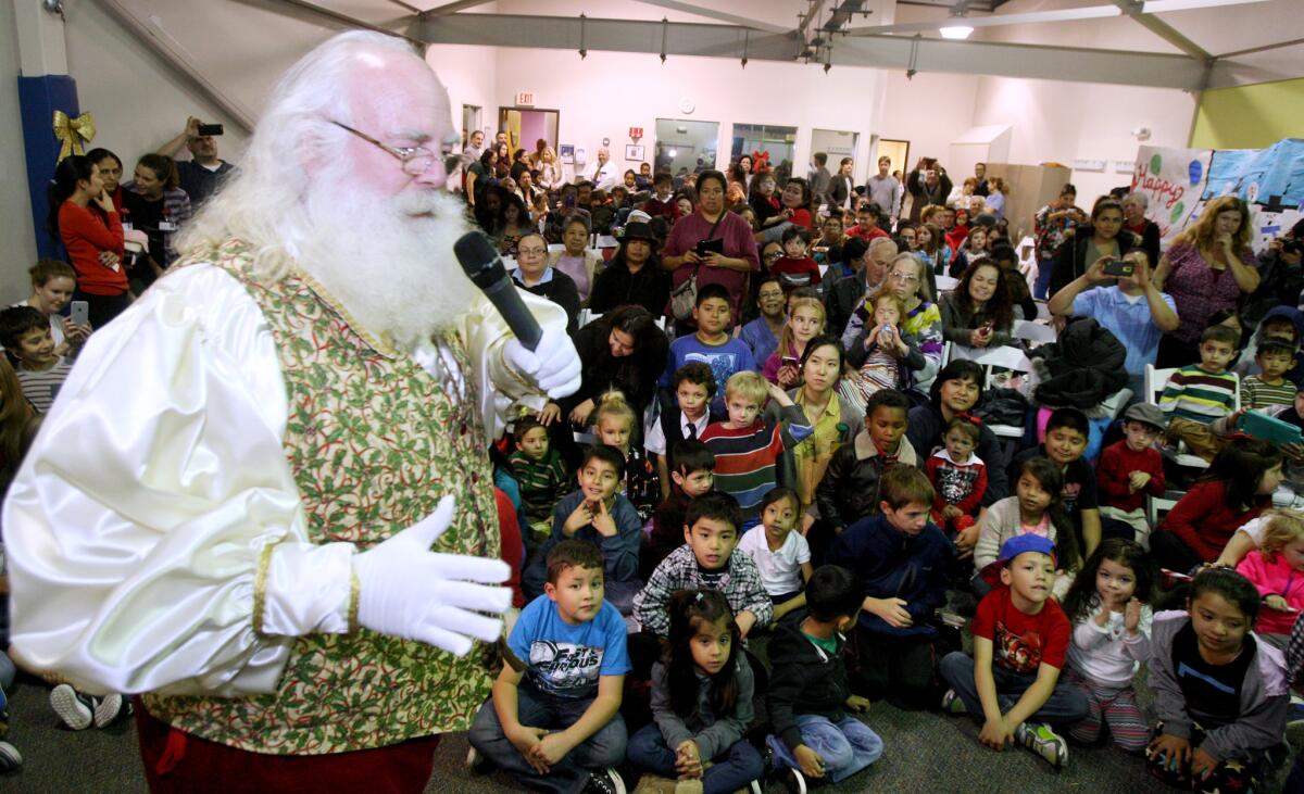 It was a packed room where Santa Claus made an early appearance during the Glendale Adventist Medical Center-sponsored Christmas party at the Play to Learn Center in Eagle Rock on Tuesday, Dec. 15, 2015.
