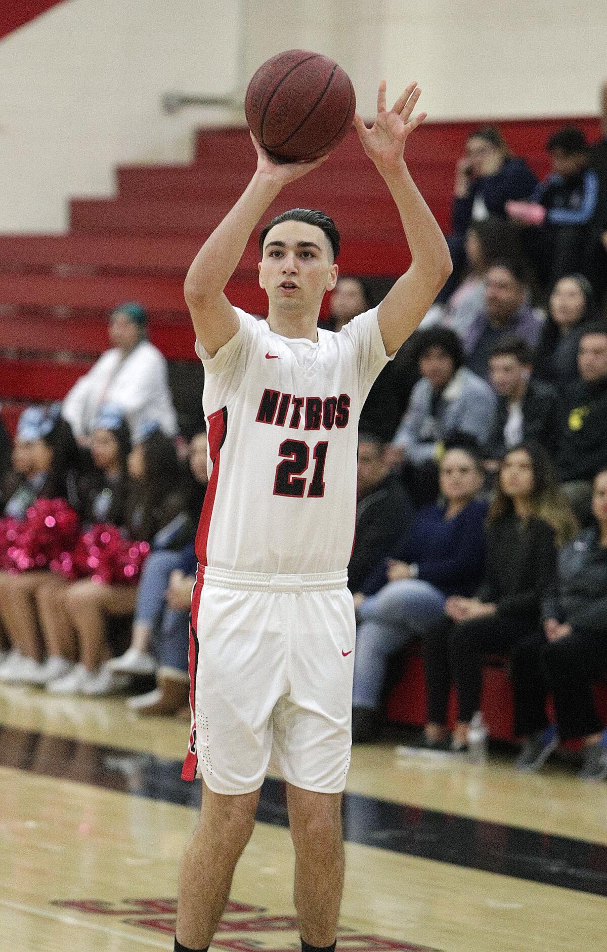 Glendale's Manouk Manoukian pulls up at the three-point line to shoot against Salesian in the CIF Southern Section division III-AAA second-round boys' basketball playoff in at Glendale High School on Friday, February 14, 2020. Salesian won the game in overtime beating Glendale 55-49.