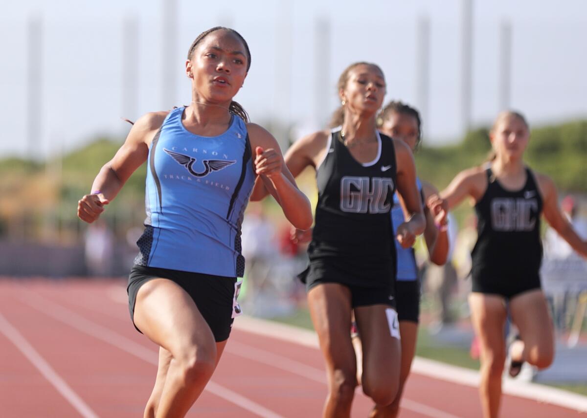Carson High sophomore Christina Gray, left, wins the 100-meter dash at the City Section track and field championships