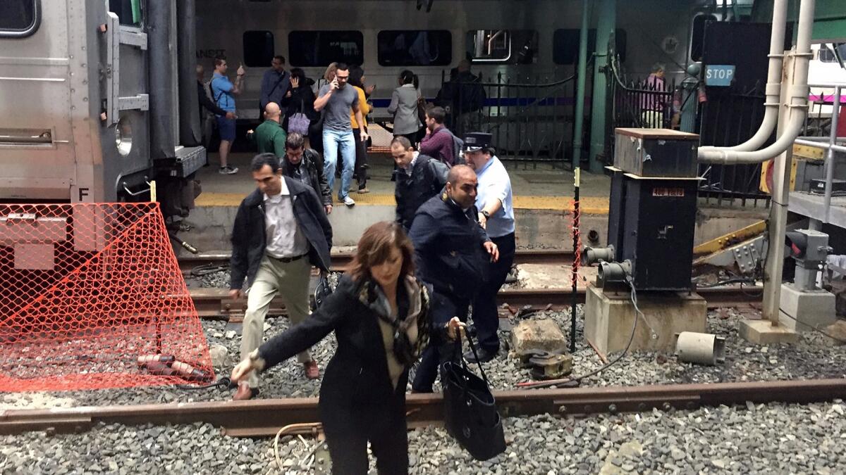 Passengers rush to safety after a New Jersey commuter train crashed into the platform at the Hoboken station on Sept. 29.
