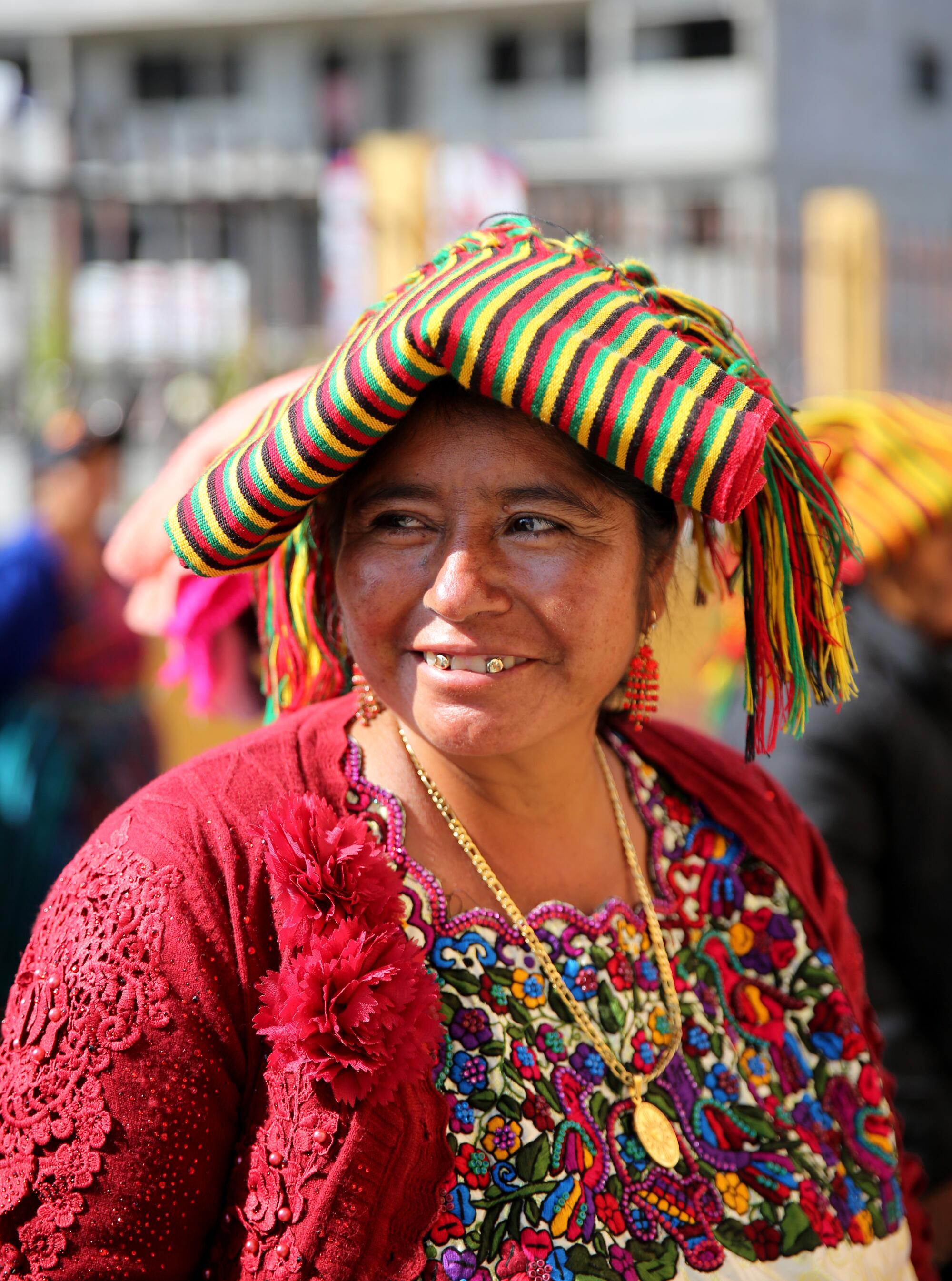 A woman wears her Indumentaria Maya (Mayan clothing) while attending a wedding at the Iglesia