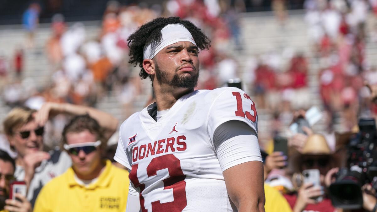 Quarterback Caleb Williams stands on the field after a game between Oklahoma and Texas.