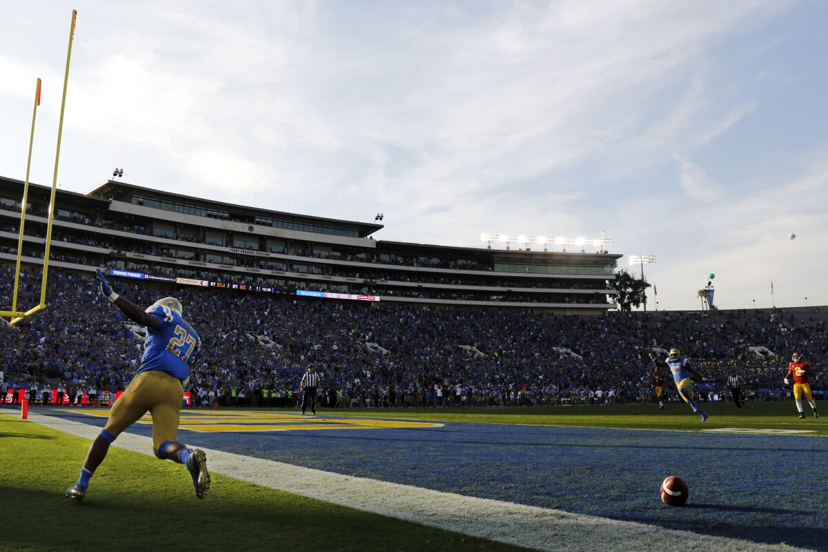 UCLA running back Joshua Kelley celebrates after scoring a touchdown against USC last year.