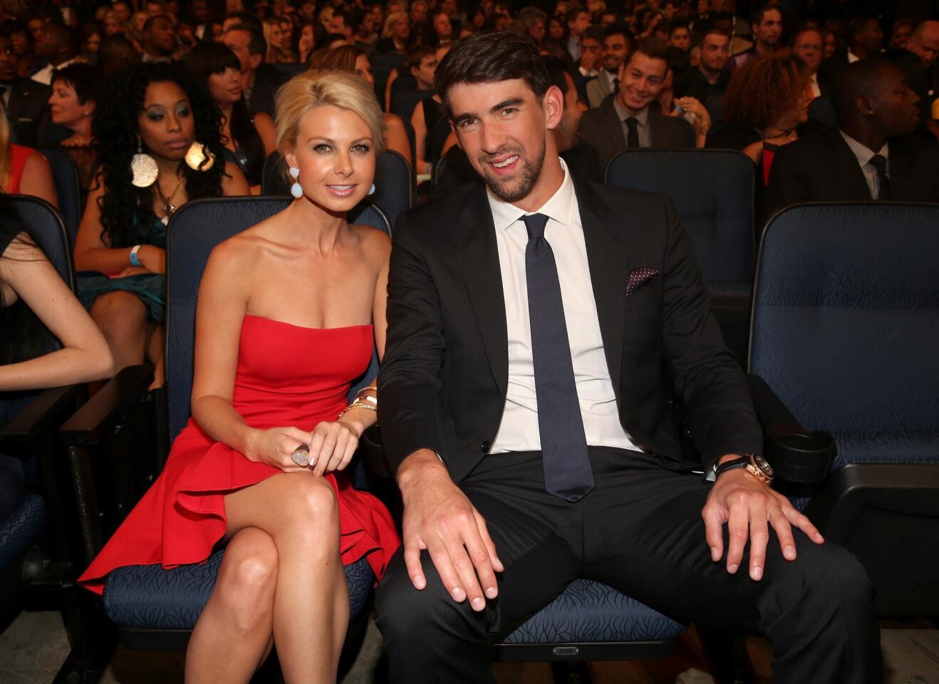 Yes, Michael Phelps has a new love interest. Phelps, 28, stepped out with date Win McMurry, also 28, at Wednesday's ESPY Awards, and we're naturally curious about her. We're assuming you are, too. The pair has reportedly been dating since June. Here's 10 things to know about the Phelps' new lady. --By Jordan Bartel