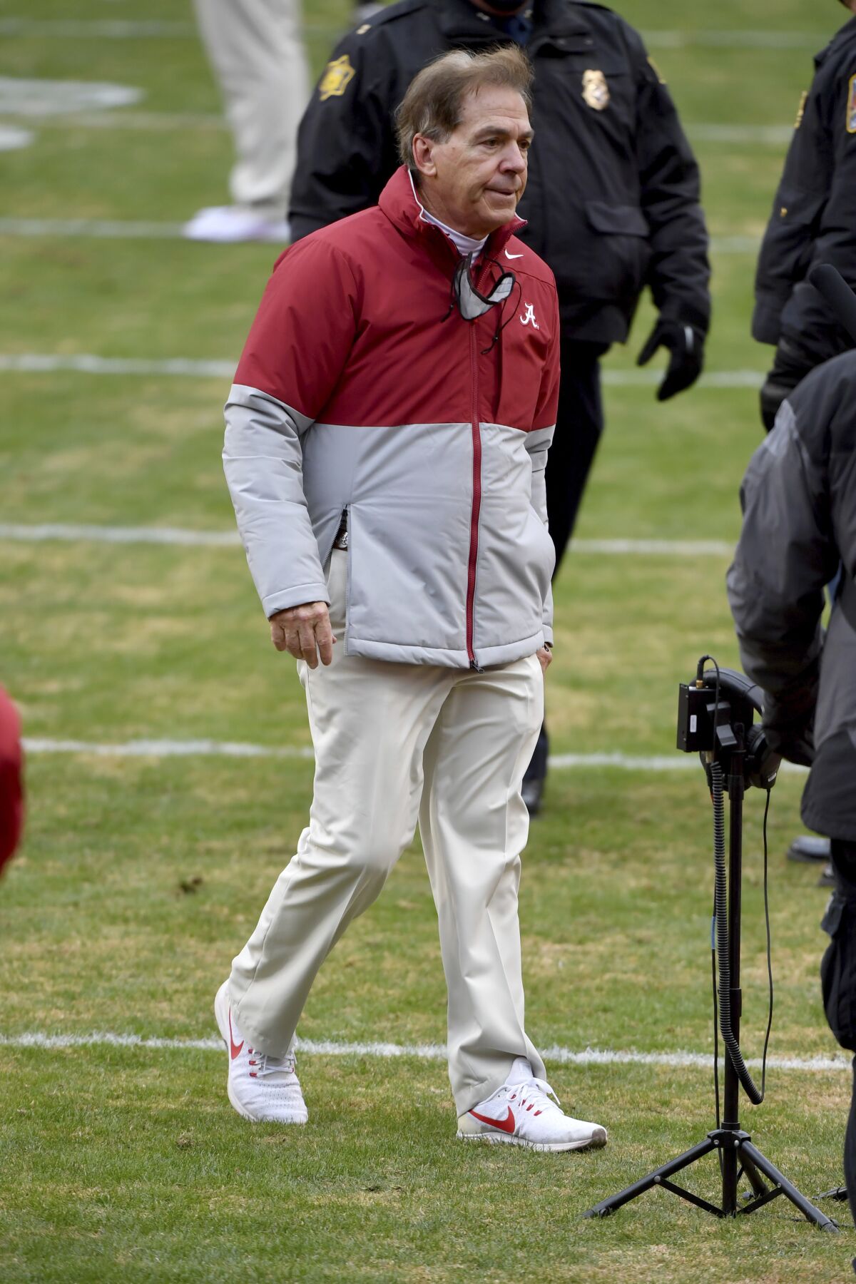 Alabama coach Nick Saban heads off the field following Alabama's 52-3 win over Arkansas in an NCAA college football game Saturday, Dec. 12, 2020, in Fayetteville, Ark. (AP Photo/Michael Woods)