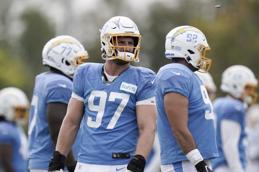 Los Angeles Chargers defensive end Joey Bosa stands on the field during an NFL football camp practice, Monday, Aug. 17, 2020, in Costa Mesa, Calif. (AP Photo/Jae C. Hong)