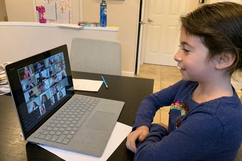 A SDJA student participates in a whole-class session from home.