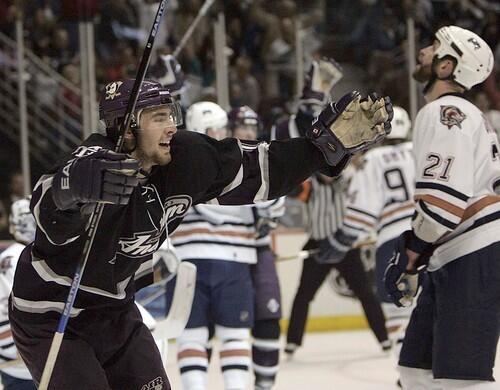 Mighty Ducks' Joffrey Lupul celebrates Andy McDonald's goal past Edmonton Oilers goaltender Dwayne Roloson.