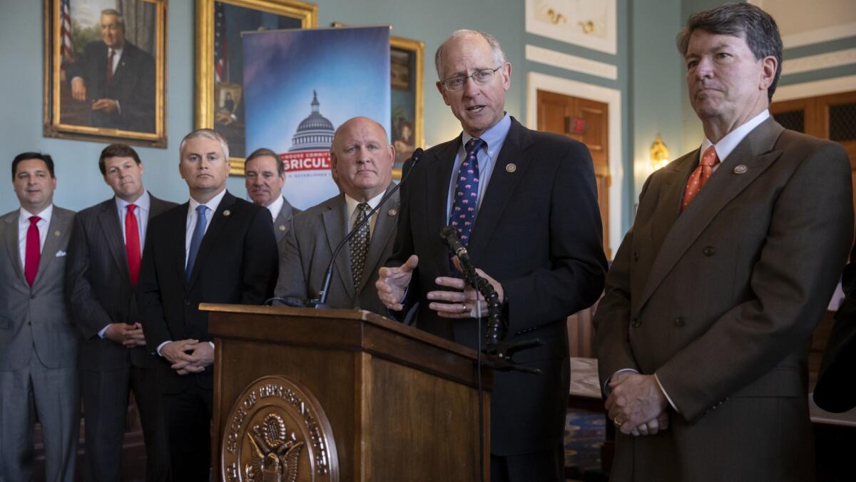 House Agriculture Committee Chairman Mike Conaway and other Republican members of the panel discuss the new farm bill on April 12.