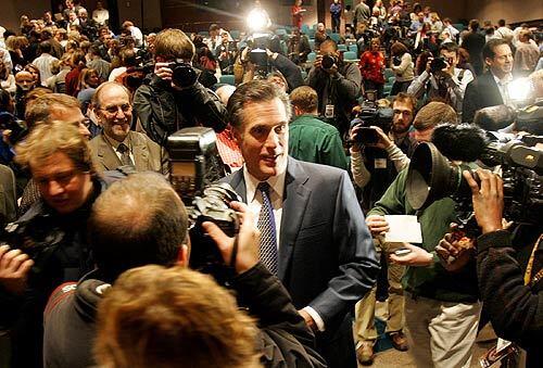 Romney surrounded by media