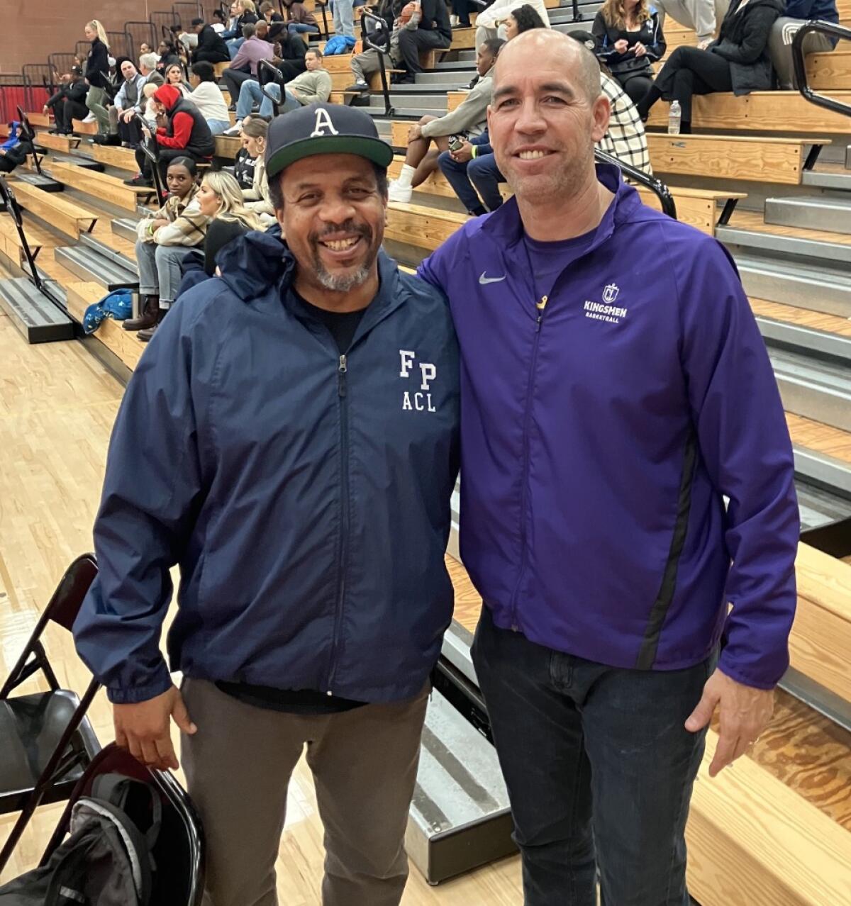 Cal Lutheran basketball coach Russell White (right) meeting Russell White, the football player from Crespi.