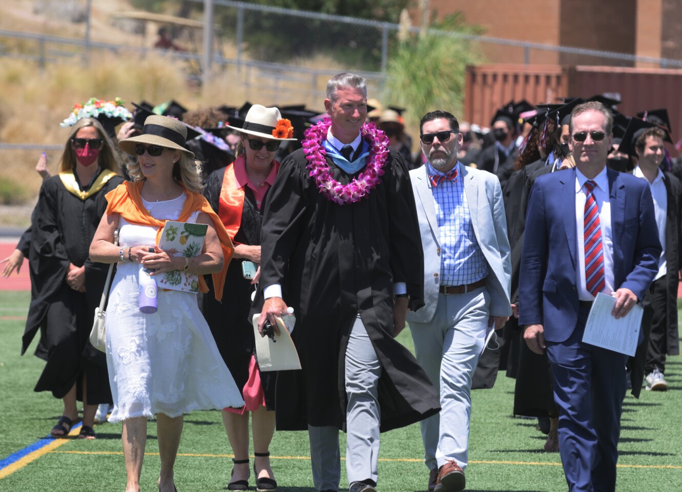 Principal Brett Killeen and honored guests lead the procession of graduates