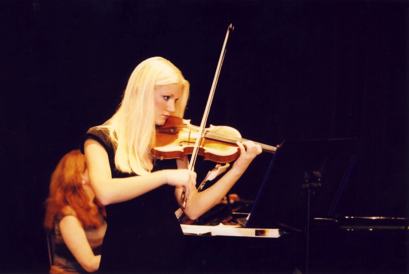 Kiersten Riedler plays the violin at her first concert at La Jolla Country Day School in May 2003.