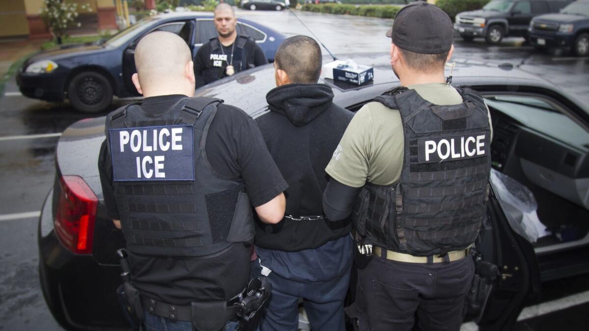 A Sacramento man filed a claim Wednesday alleging U.S. Immigration and Customs Enforcement agents beat him to force his cooperation as an informant. In this 2017 photo, agents arrest a man during an enforcement operation in L.A.