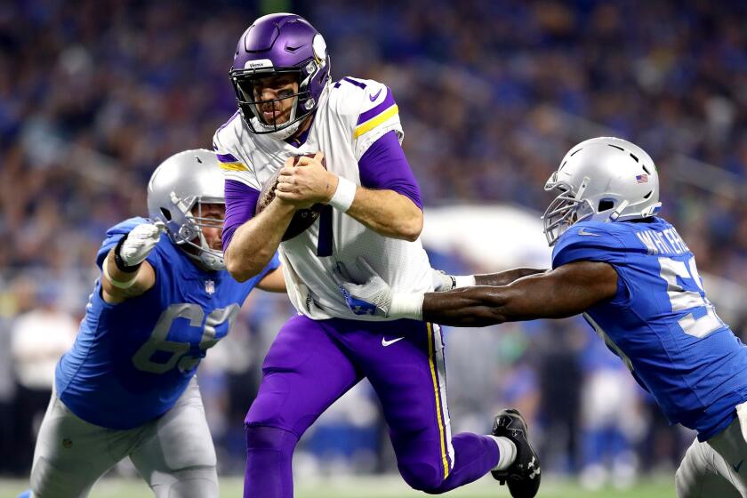 DETROIT, MI - NOVEMBER 23: Quarterback Case Keenum #7 of the Minnesota Vikings runs with the ball against Anthony Zettel #69 of the Detroit Lions and Tahir Whitehead #59 for a touchdown against the Detroit Lions during the first half at Ford Field on November 23, 2017 in Detroit, Michigan. (Photo by Gregory Shamus/Getty Images) ** OUTS - ELSENT, FPG, CM - OUTS * NM, PH, VA if sourced by CT, LA or MoD **